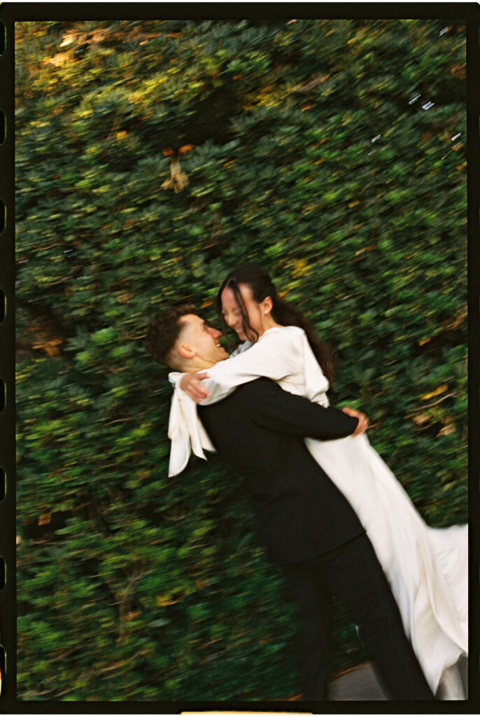 bride and groom take their documentary style wedding photos outdoors