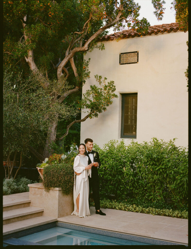 bride and groom take their documentary style wedding photos outdoors