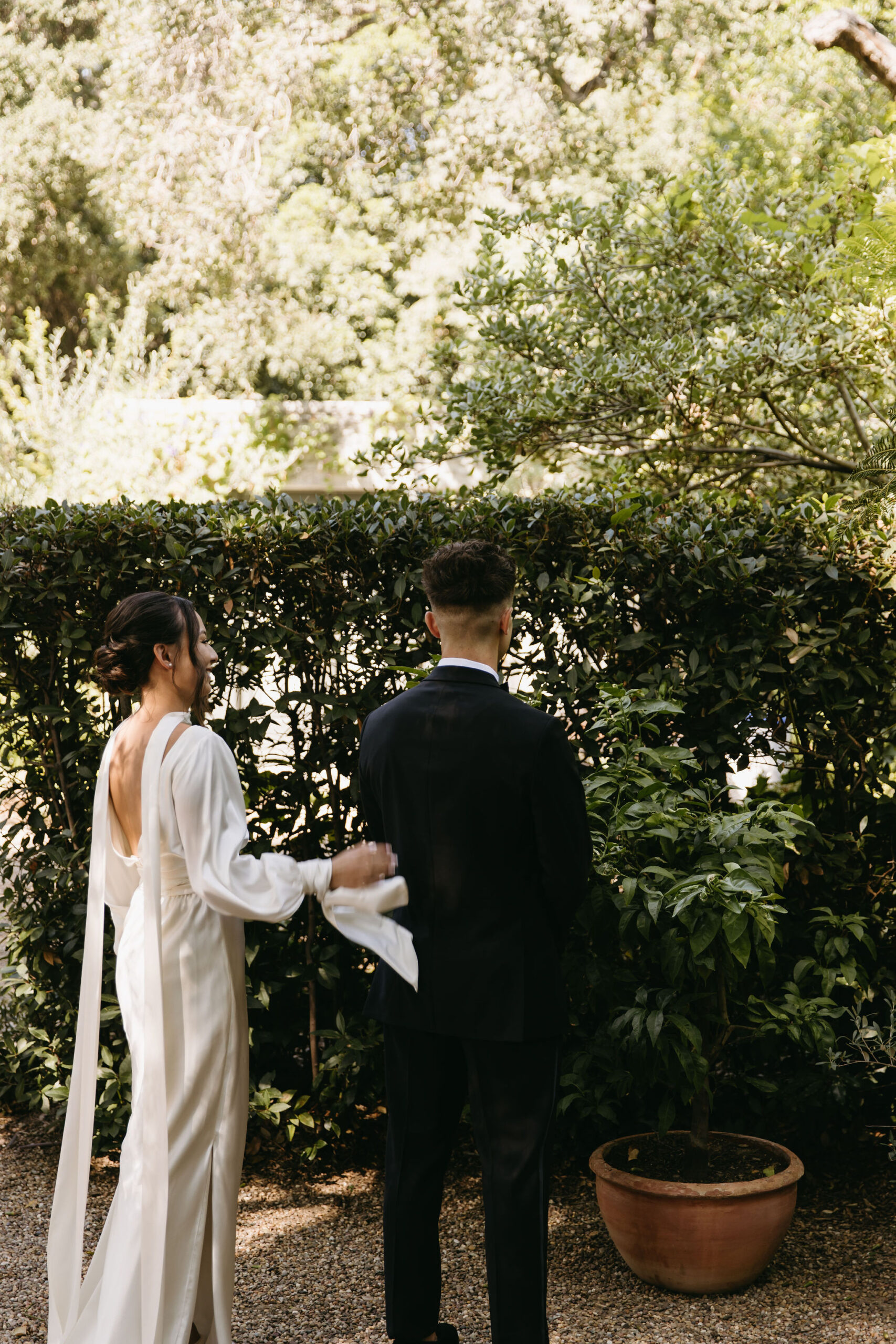 bride and groom take their documentary style wedding photos  outdoors 