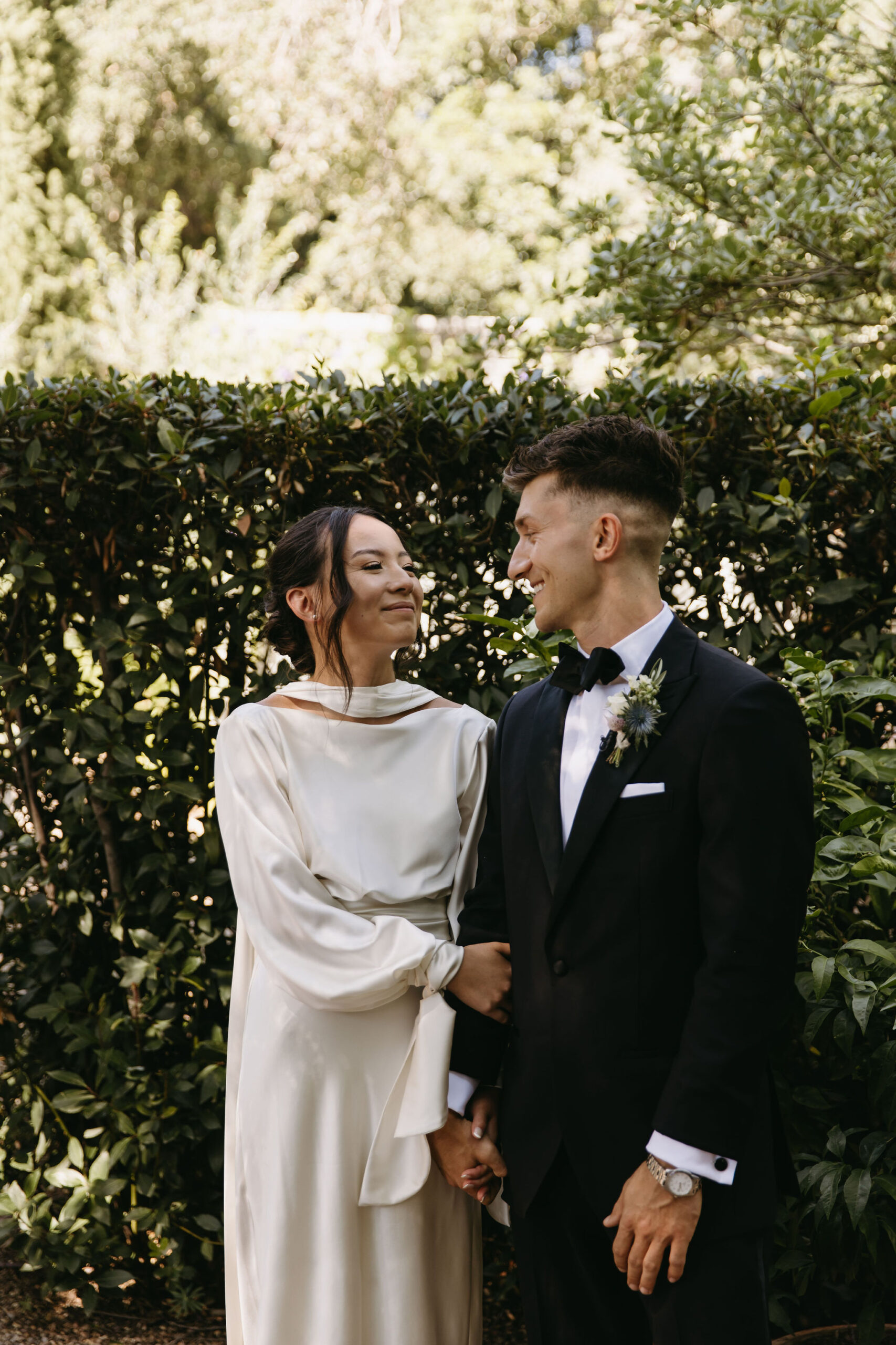 bride and groom take their documentary style wedding photos  outdoors 