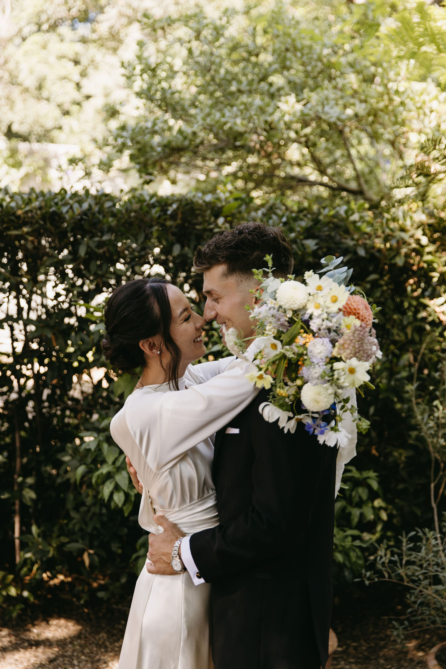 bride and groom take their documentary style wedding photos  outdoors 