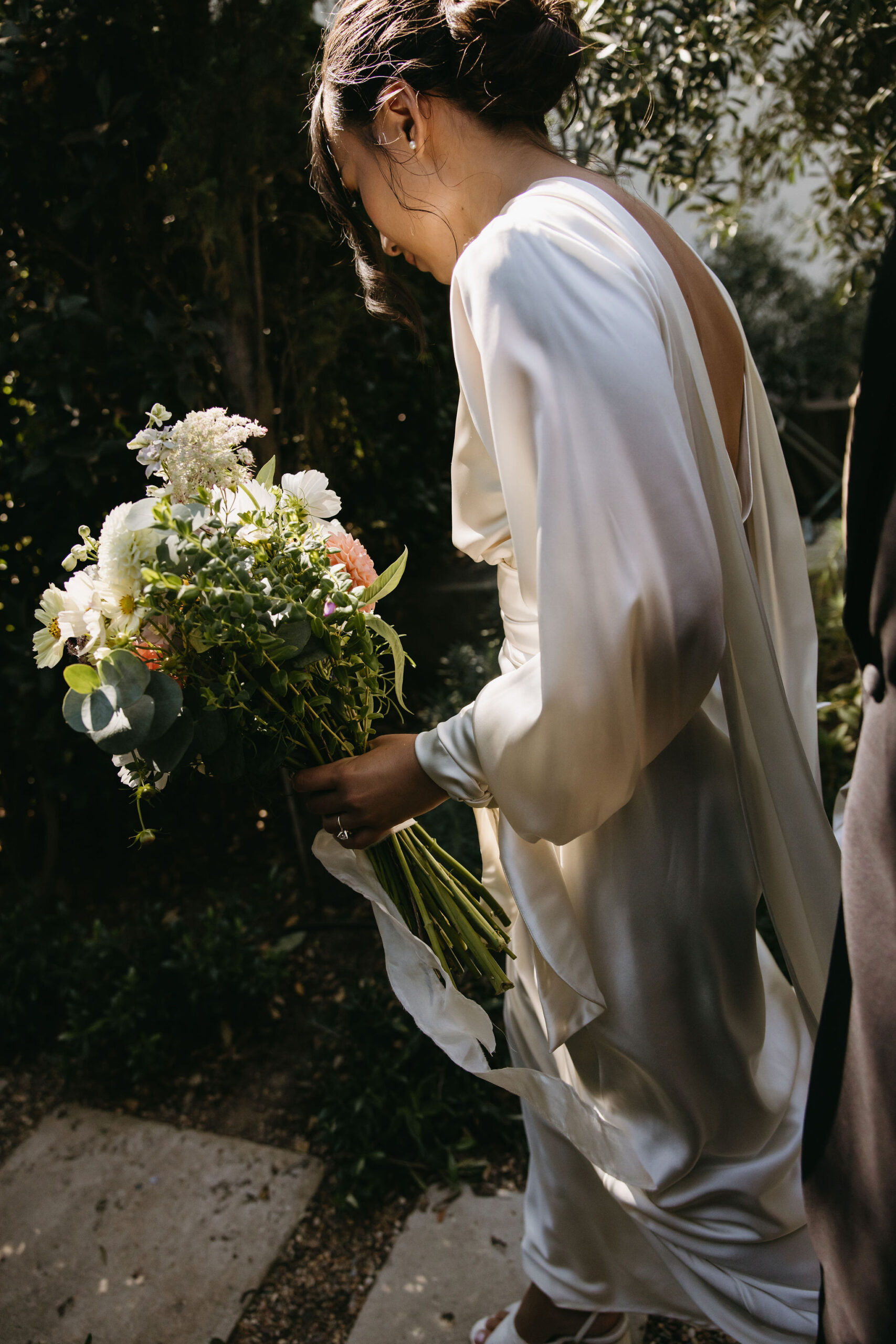 bride and groom take their documentary style wedding photos outdoors