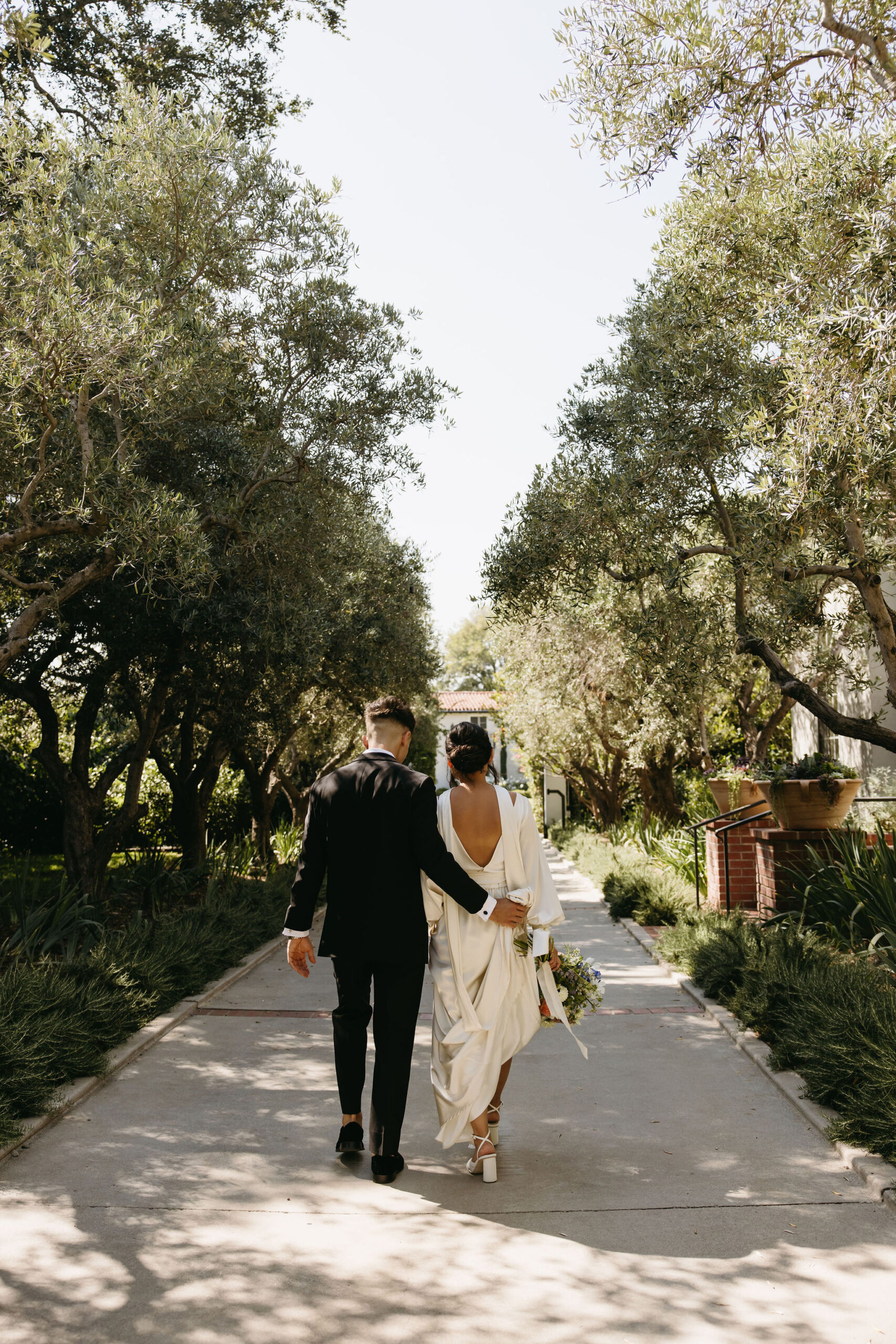 bride and groom take their documentary style wedding photos  outdoors 