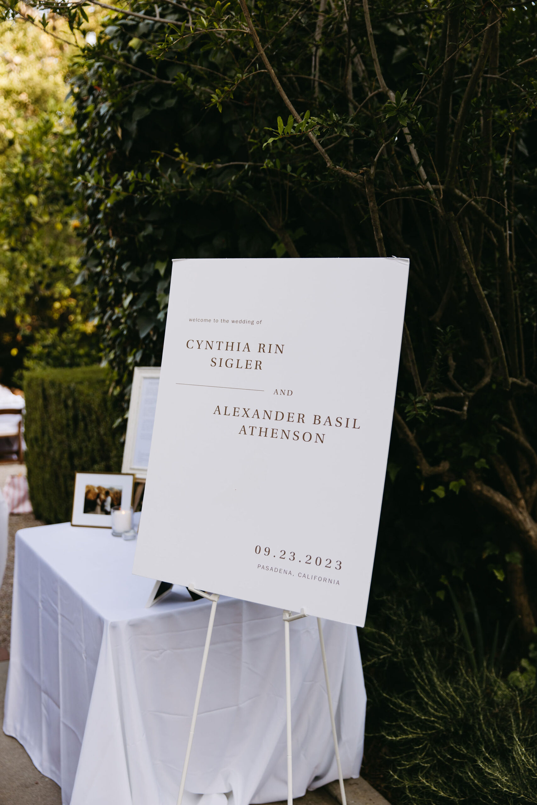 A sign on a stand for a wedding reception