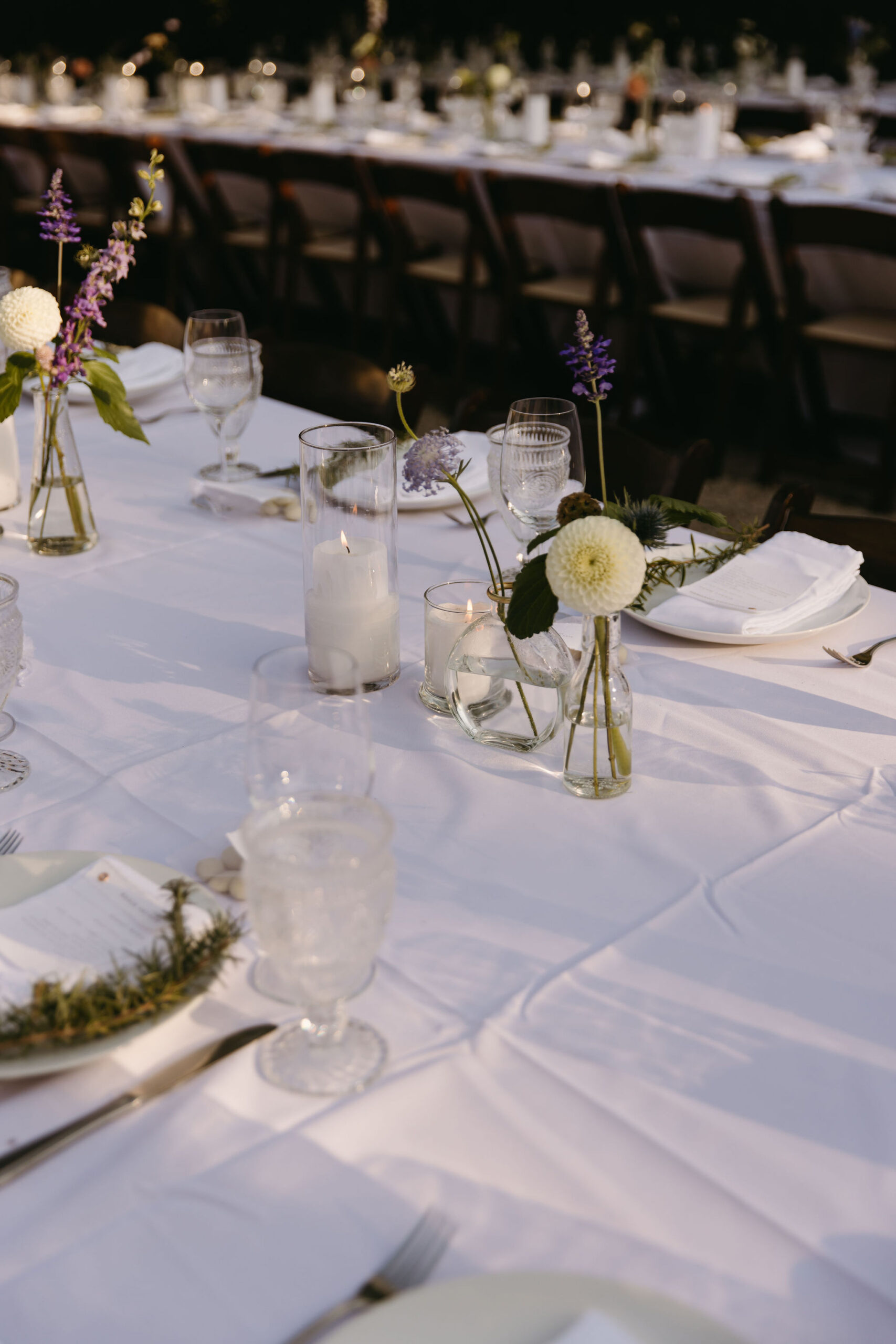 Wedding tablescape decorated with candles and flowers for a wedding reception