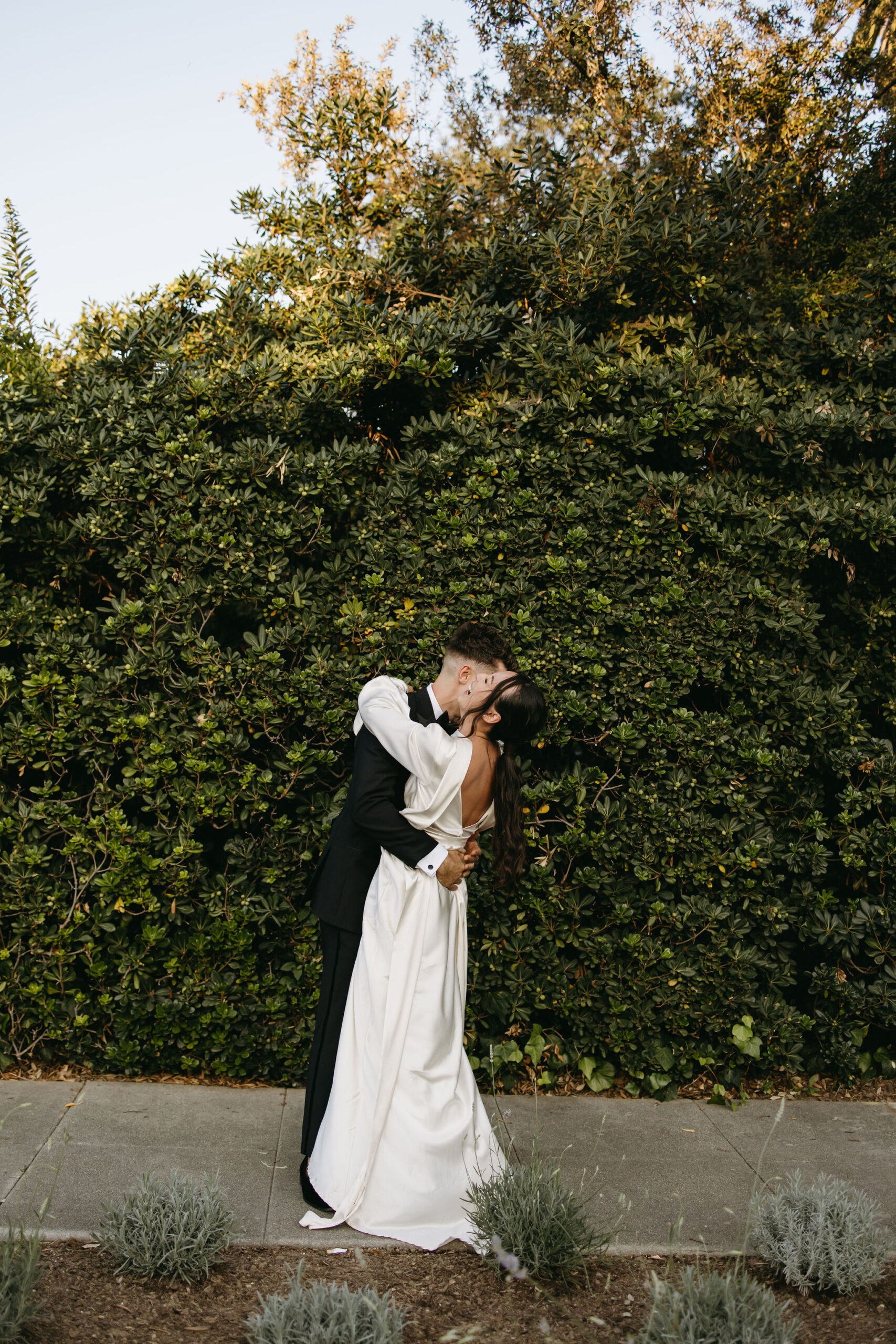 bride and groom take their documentary style wedding photos  outdoors 